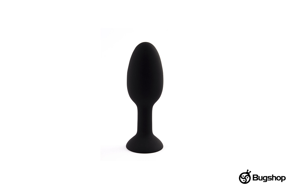 Oval anal plug with an internal ball